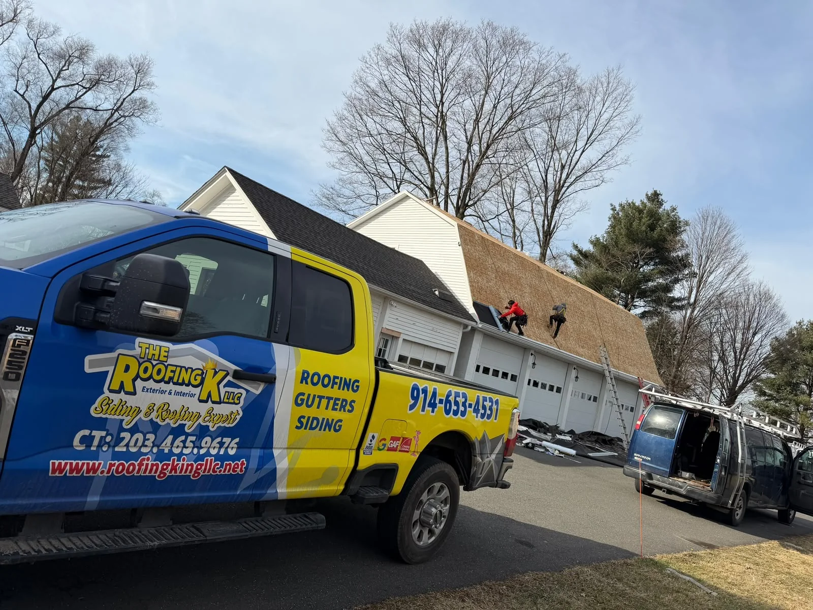 Roofing King truck at an active job site